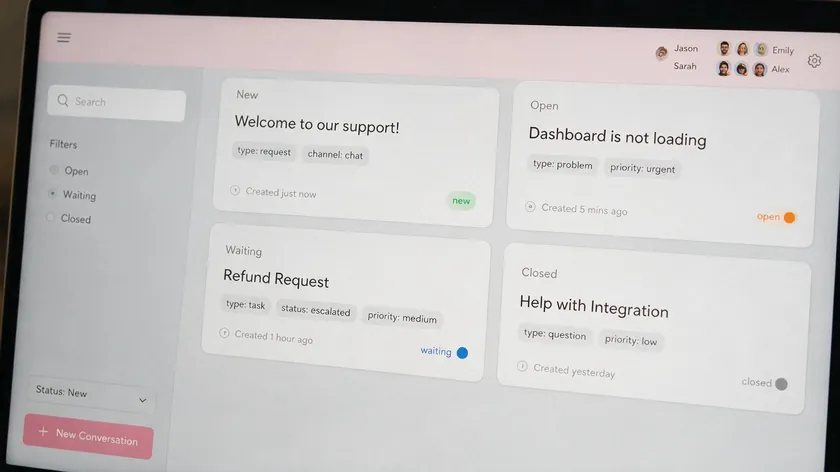 Laptop screen showing a shared inbox with conversations labeled by status, such as assigned, open, and resolved.